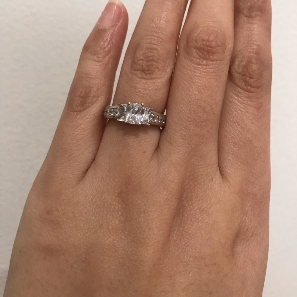 Silver emerald cut three stone engagement ring